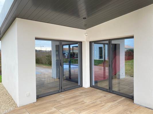 Baies vitrées accordéon vitrage effet miroir